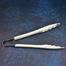 Kitchen tongs with easy grip handles.